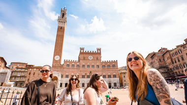 Travellers in Piazza del Campo, Siena, Italy