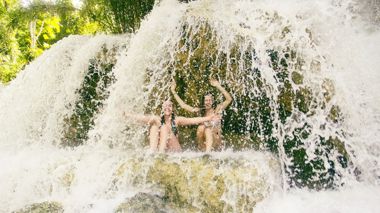 Travellers at Tat Se Waterfalls in Luang Prabang, Laos