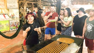 Travels with a local guide at a local factory in the Mekong Delta, Vietnam