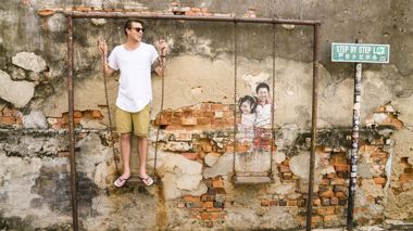 A Traveller next to street art in Georgetown, Penang, Thailand