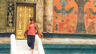 A Traveller at Wat Xieng Thong Temple in Luang Prabang, Laos