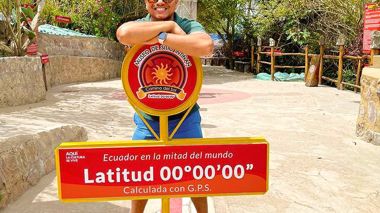 Traveller at the Equator Sign in Quito, Ecuador