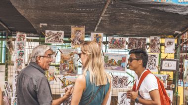 Travellers at a handicraft stall in Quito, Ecuador