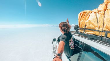 Traveller taking a selfie while in a 4wd on the Salt Flats of Uyuni, Bolivia