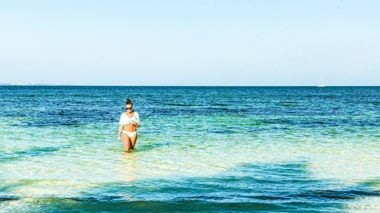 Traveller in the sea at Cancun in Mexico