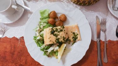 A plate of salmon and vegetables at an Icelandic dinner in Reykjavic, Iceland