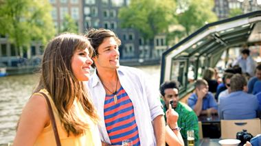Travellers on a canal cruise in Amsterdam