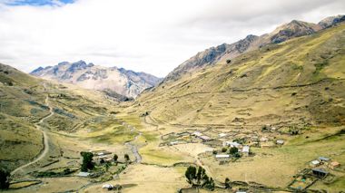View Of Hills And Houses On Lares Valley Trek In Peru