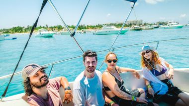 Four Travellers Relaxing on Boat in Bay, Puerto Vallarta, Mexico