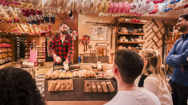Travellers watching a clog maker in Edam, Netherlands