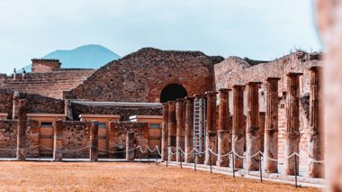 Ancient ruins at Pompeii with Mt Etna in the background in Italy