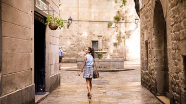 Traveller exploring the gothic streets of of Barcelona, Spain