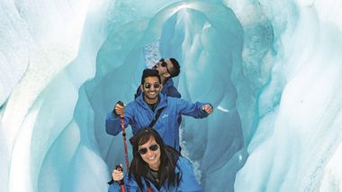 Travellers hiking through the Glaciers after their Helicopter ride in the Franz Joseph Glacier, New Zealand
