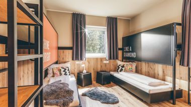 Twin bedroom in Contiki Haus Schoneck special stay in Hopfgarten, Austria.