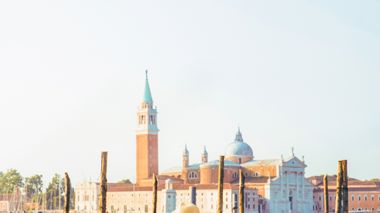 Traveller admiring the canals and gondolas of Venice, Italy
