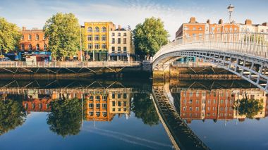 Travellers on Ha'Penny Bridge in Dublin, Ireland