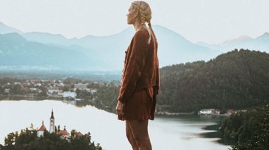 Traveller stood overlooking Lake Bled