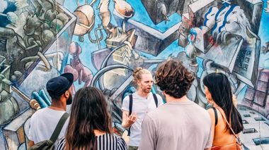 Travellers on a Street Art walking tour in Berlin, Germany