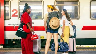 Travellers on the train platform in Rome, Italy