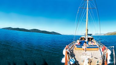 Travellers on the sailing boat heading to Cokertme in Turkey