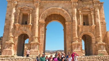 Travellers stood in front of Roman Ruins in Jerash, Jordan