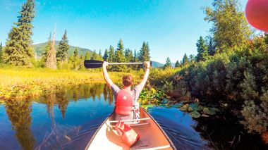 Travellers canoeing in Whistler, Canada