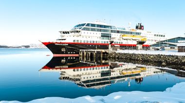 A Hurtigruten ship in the Arctic Circle anchored in Norway