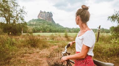 A Traveller with a bicycle at Sigiriya in Sri Lanka