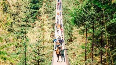 Travellers on Capilano Suspension Bridge in Vancouver, Canada