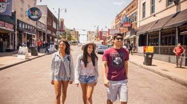 Travellers walking down a street in Memphis, USA