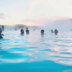Contiki travellers bathing in the Blue Lagoon geothermal spa in Iceland - Contiki Best of Iceland Tour