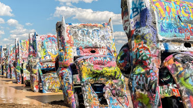 Spray painted cadillacs on display at ranch, Amarillo, USA