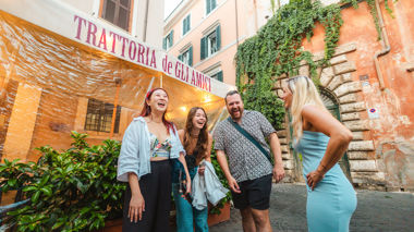 Travellers stood out side of La Trattoria de Gli Amici, Rome, Italy