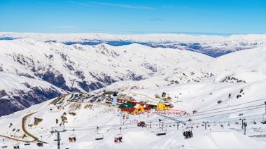View of Ski Resort and Ski Lift against Mountain Backdrop, Queenstown, New Zealand