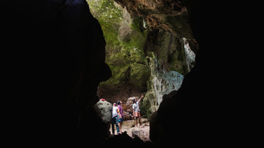 Travellers admiring caves, Indonesia