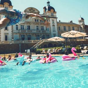 Travellers enjoying a pool party at Contiki's French château - Contiki European Adventurer Tour