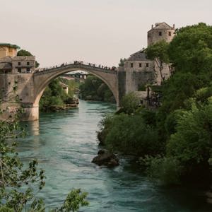 The iconic Stari Most bridge spans the Neretva River on the Contiki Dubrovnik to Budapest Tour