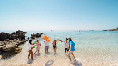 Travellers playing a game on the beach, Vlorë, Albania
