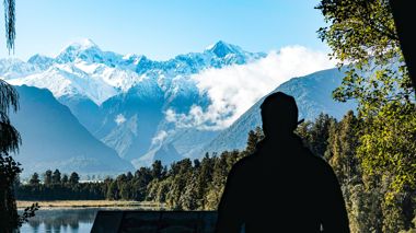 Traveler Looking Out On Fox Glacier Peak, Te Kopikopiko o te Waka, New Zealand