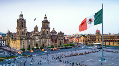 Large Mexican flag waving over Mexico City's historic square, Mexico City, Mexico