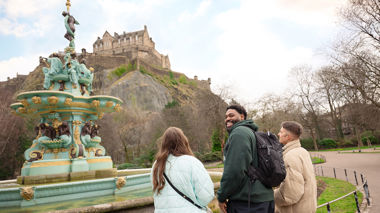 Traveller in front of Tron Kirk on the Royal Mile in Edinburgh, Scotland