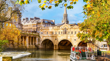 View from the water of Pulteney Bridge And River Avon In Bath, United Kingdom