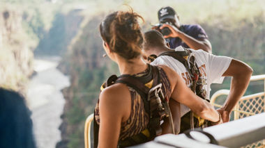 Two travellers preparing for the tandem bridge swing in Victoria Falls, Zambia