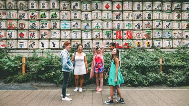 Group of Travellers Stood Beside Sake Barrels, Tokyo, Japan
