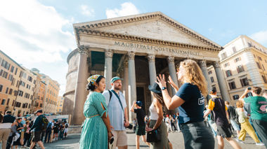Travellers listening to Contiki trip manager outside of the pantheon, Rome, Italy