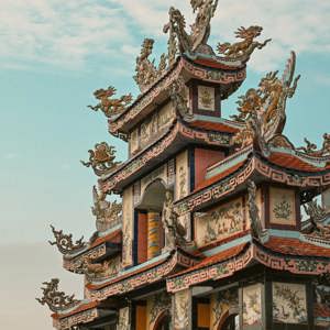Ornate pagoda at Minh Cung Temple in Vietnam, showcasing traditional architecture - Contiki HCMC, Hoi An & Hanoi Tour