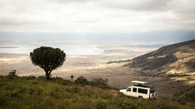 Safari vehicle driving on the edge of the Ngorongoro Crater, Tanzania