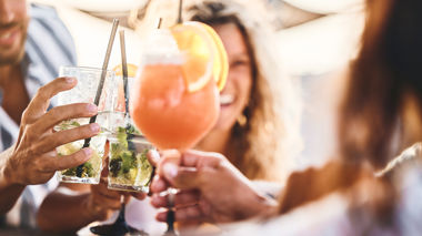 Travellers toasting cocktails