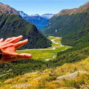Panoramic view of a mountain valley and winding river in New Zealand on the Contiki Active New Zealand Tour