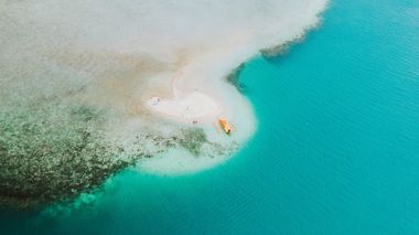 Aerial View over Yellow Boat next to White Sand Bar and Beach, Palawan, Philippines